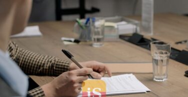 documents signing pen desk