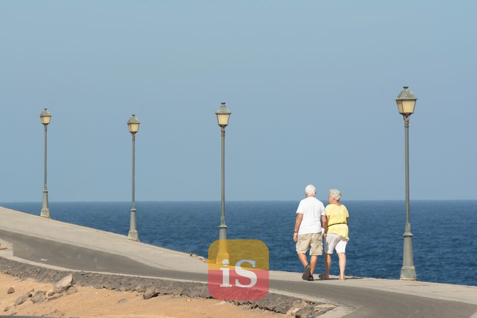 elderly couple sea walk